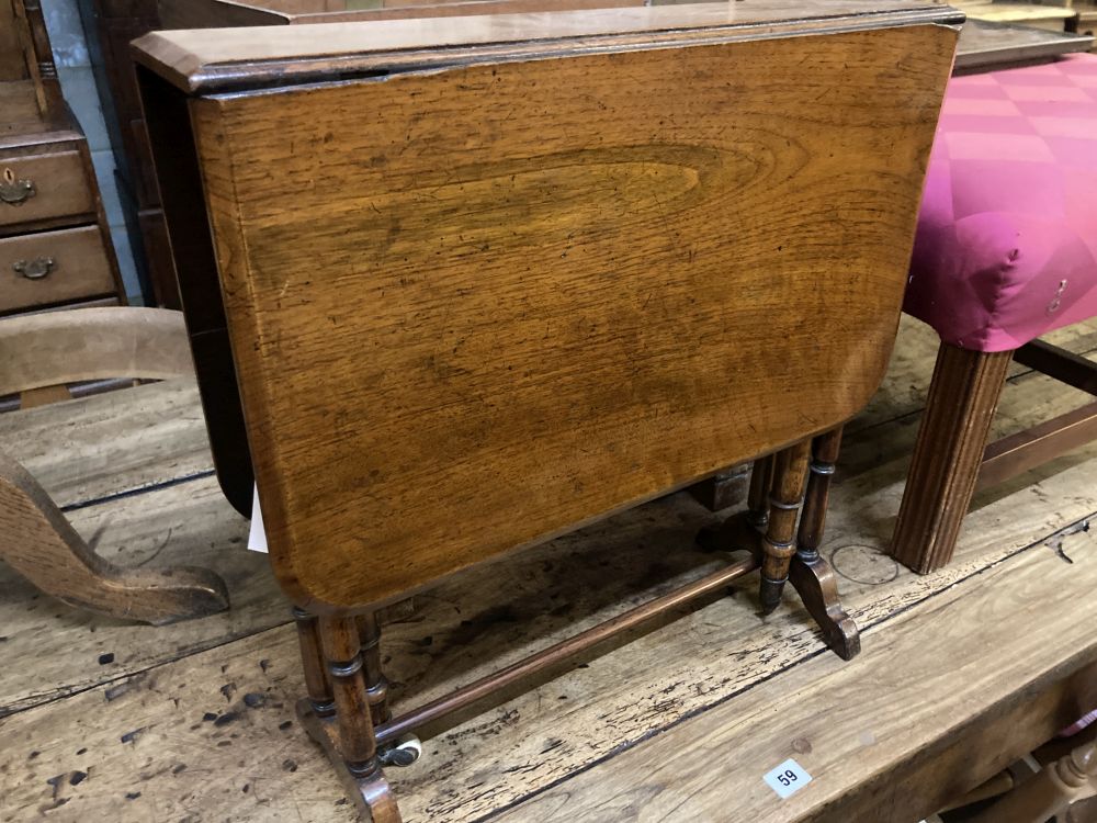 A small late Victorian walnut Sutherland table, width 50cm height 52cm